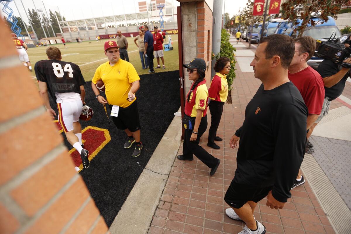 USC Coach Steve Sarkisian takes to the Trojans' practice field Tuesday morning after addressing the media about his behavior and language at Saturday's "Salute to Troy" event.