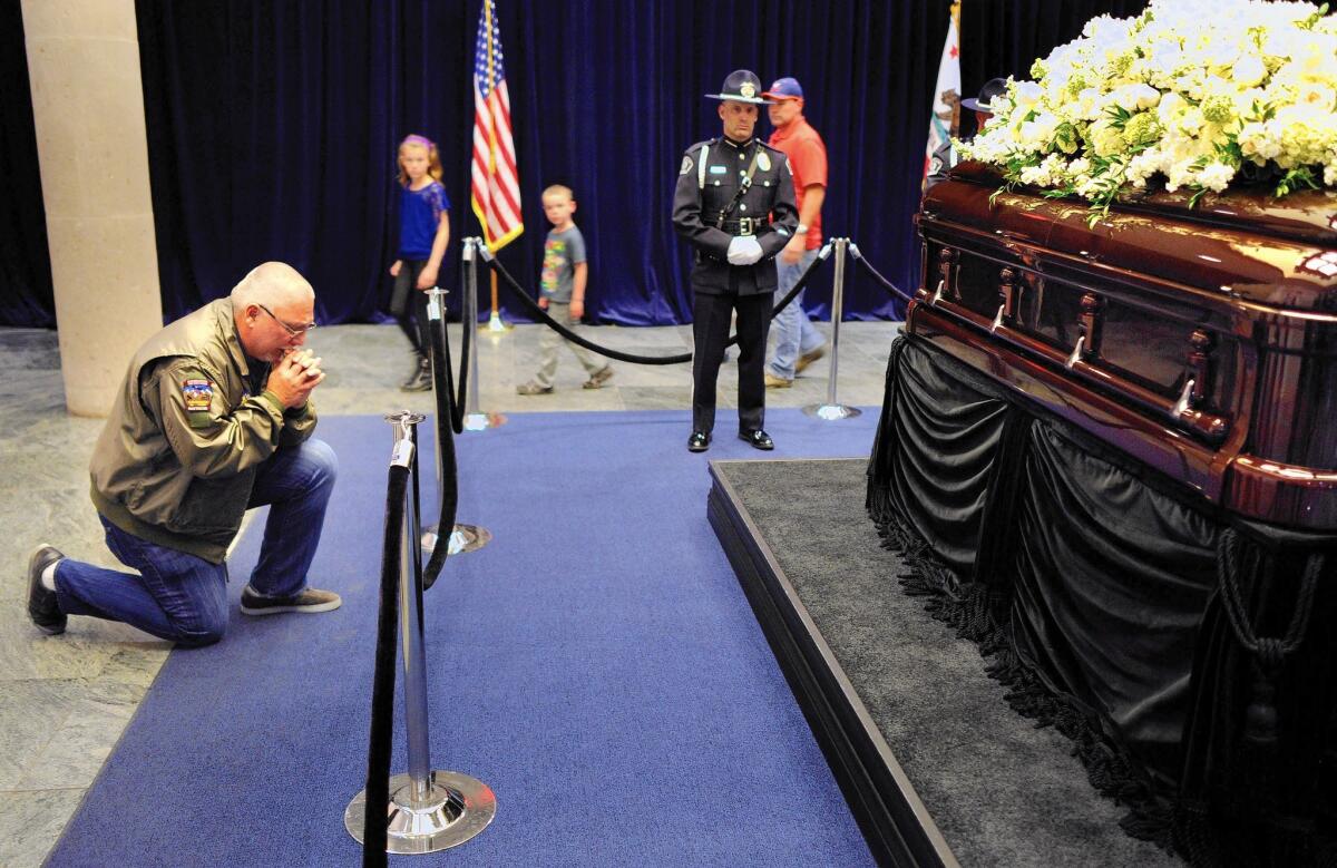 Steven Leslie prays in front of the casket of former First Lady Nancy Reagan at the Reagan Presidential Library in Simi Valley on Wednesday.