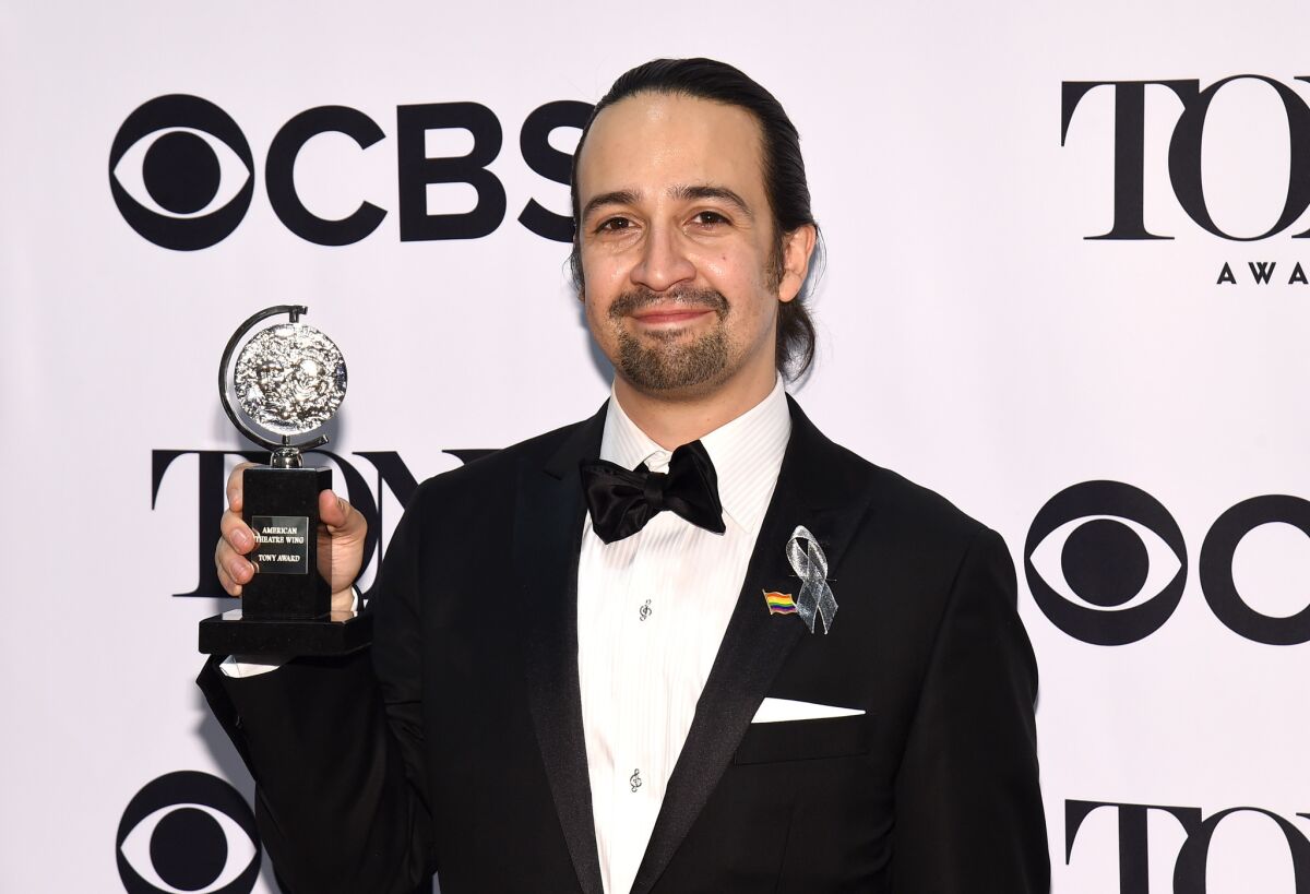Lin-Manuel Miranda poses with the award for best musical at the Tony Awards on June 12.