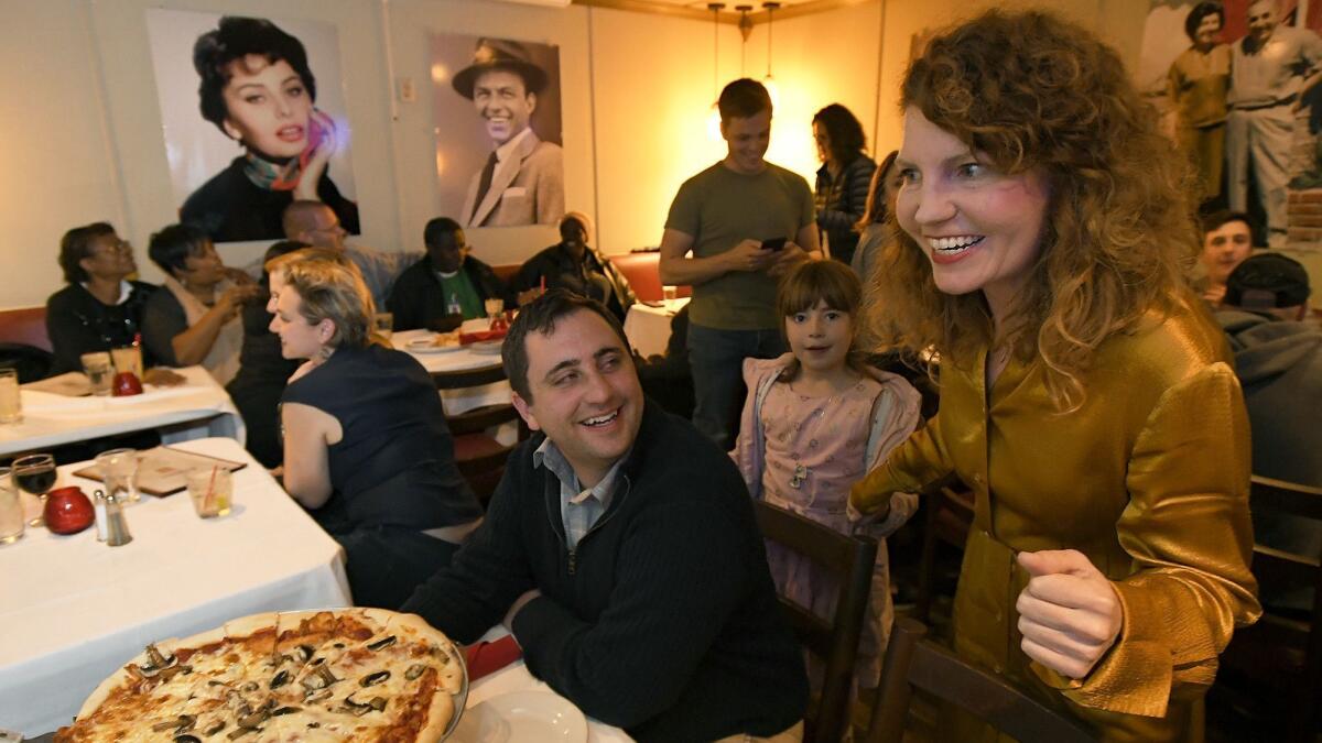 Heather Repenning, right, gathers with supporters to wait for returns on election night.