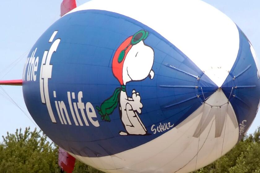 The MetLife Snoopy Two blimp comes in for a landing at the Park Township Airport in Holland, Mich. in 2007.