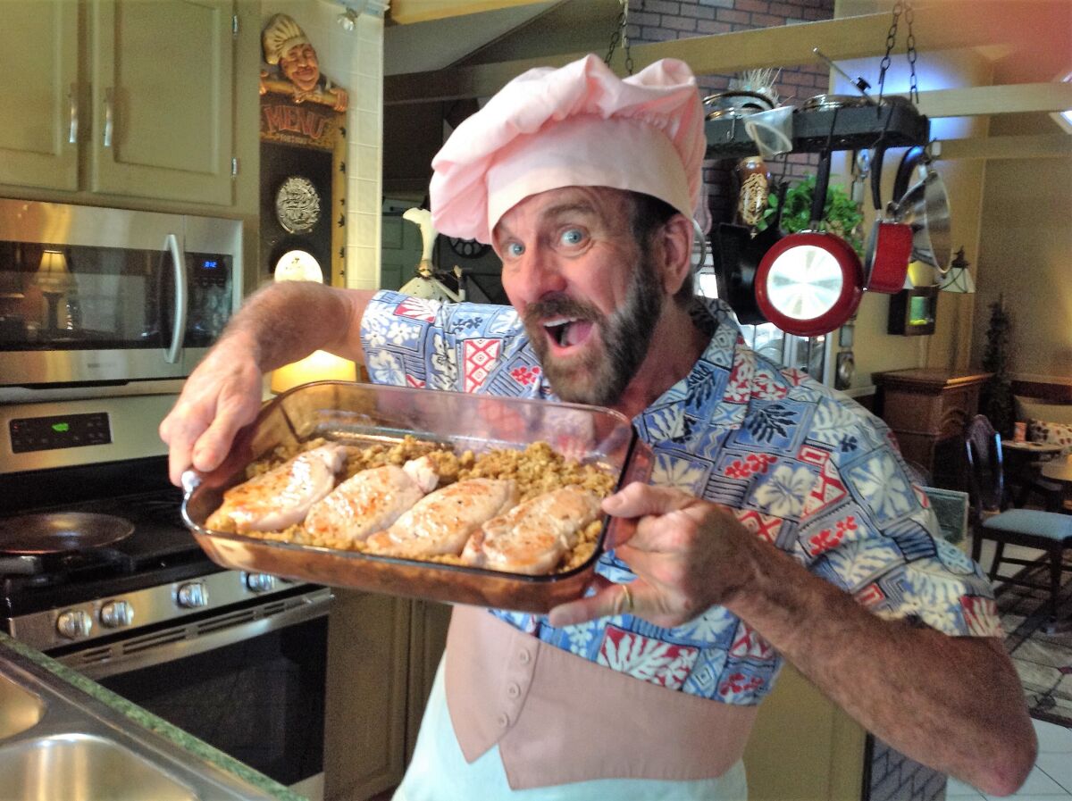 Fallbrook theater producer Doug Davis prepares to cook a pork chop dish that won a cooking contest he and his partner Randall Hickman launched on Facebook in mid-March.