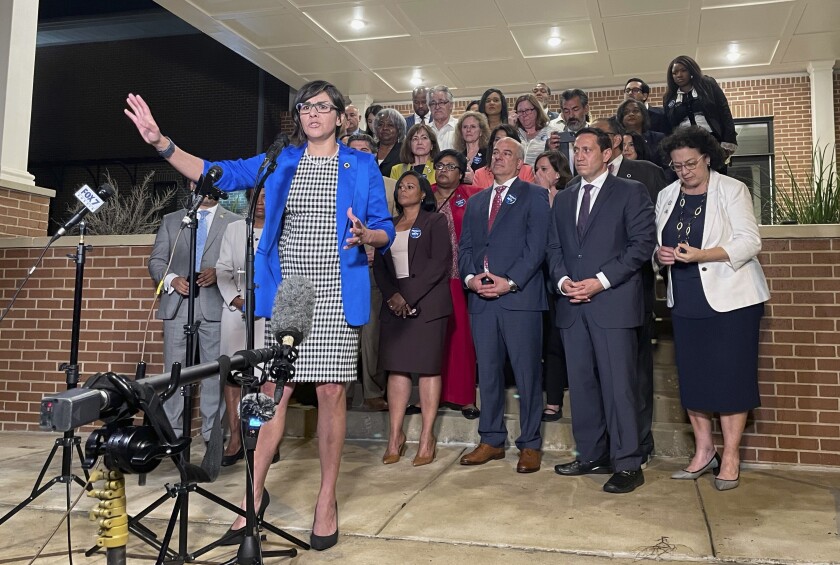 Texas state Rep. Jessica Gonzalez speaks during a news conference in Austin. Behind her are other politicians.