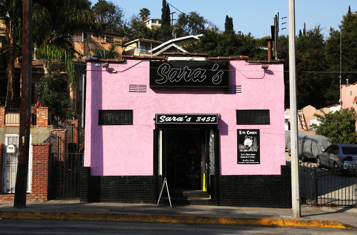 A photo of pink building that is home to Sara's Market in Los Angeles.