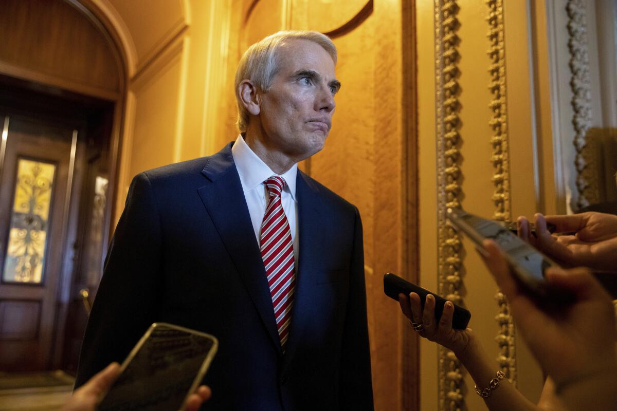 Ohio Republican Sen. Rob Portman speaks to reporters