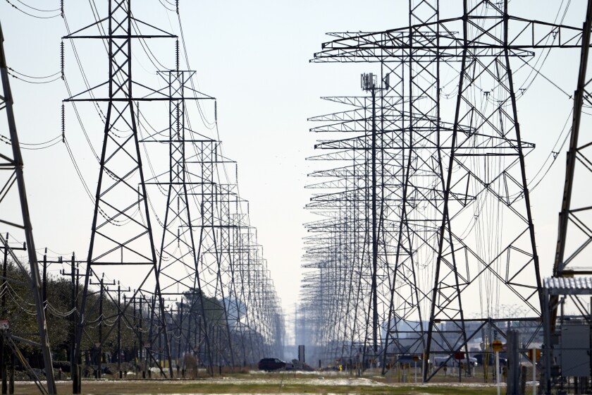 Electrical towers rise in two rows 