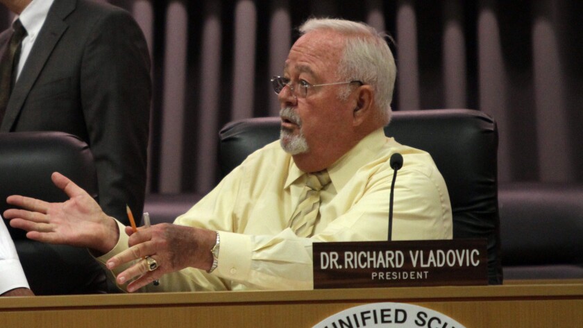 Richard Vladovic attends school board meeting.