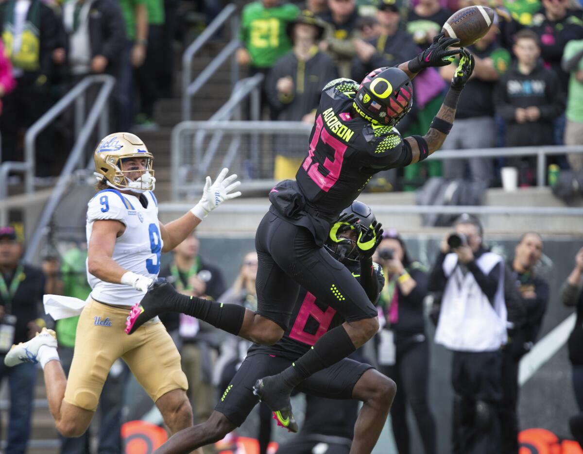 Oregon's Bryan Addison breaks up a pass intended for UCLA wide receiver Jake Bobo in the end zone.
