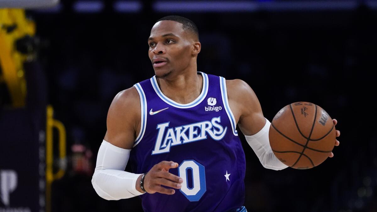 Lakers' Russell Westbrook dribbles the ball during the first half against the Minnesota Timberwolves.