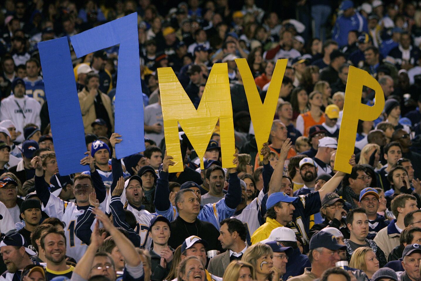 Fans of the San Diego Chargers hold up a sign for Philip Rivers for MVP against the Denver Broncos at Qualcomm Stadium on Sunday, Dec. 28, 2008.
