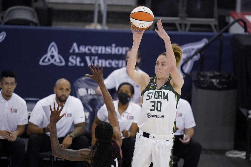 Seattle Storm's Breanna Stewart shoots over Indiana Fever's Jessica Breland during the second half of a WNBA basketball game Thursday, June 17, 2021, in Indianapolis. (AP Photo/Darron Cummings)