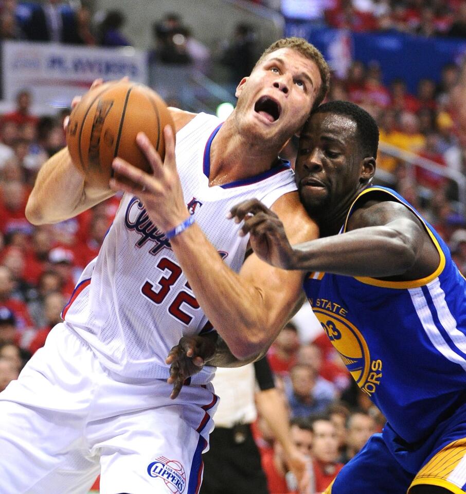 Clippers power forward Blake Griffin, left, is fouled by Golden State Warriors small forward Draymond Green during the first half of Game 7 of the Western Conference quarterfinals at Staples Center.