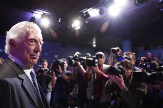 Peruvian writer Mario Vargas Llosa arrives for a news conference for his new book 'Tiempos recios' in Madrid in 2019.