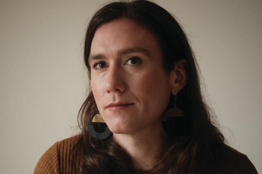 author's debut books A person with long hair and a ribbed brown sweater.