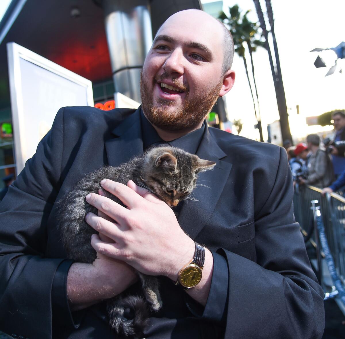 Peter Atencio, pictured with a kitten, during happier times. (Buckner/Rex Shutterstock/Zuma Press/TNS)