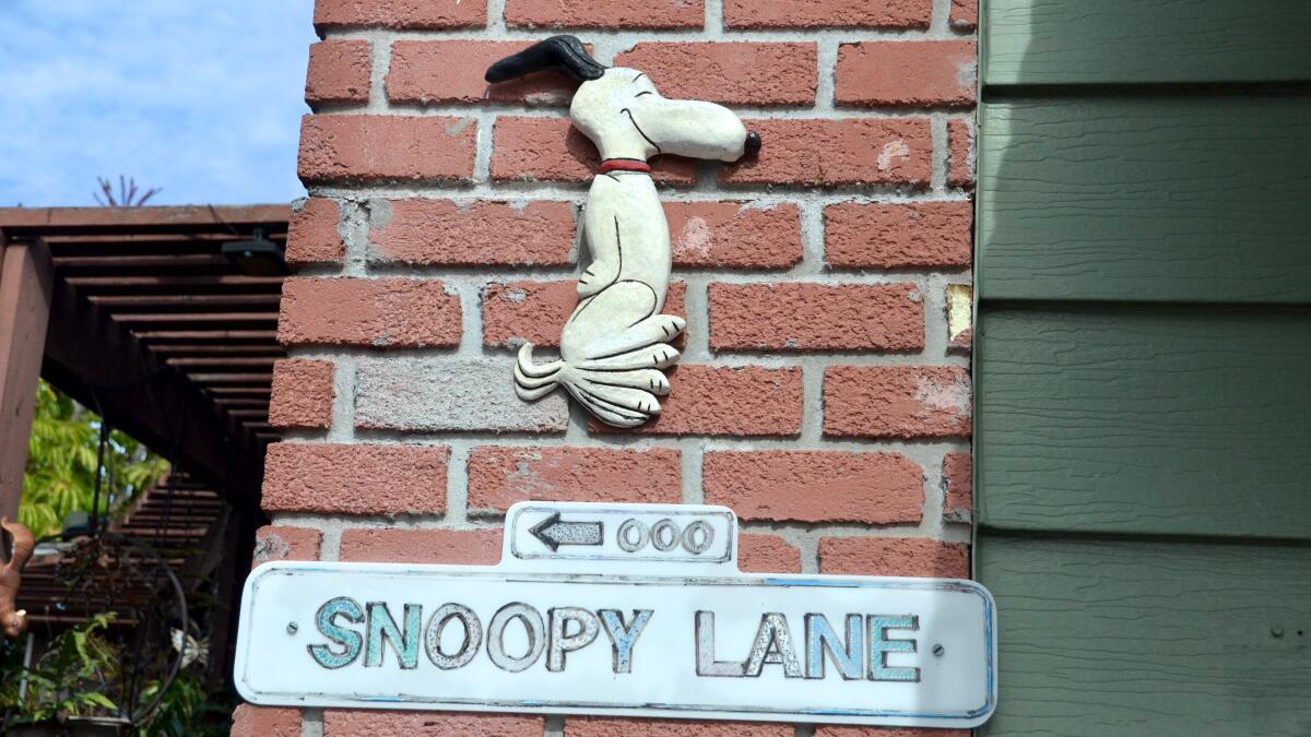 A wooden Snoopy is affixed to the chimney of Dean and Marianne Cole's Newport Beach cottage. It is part of the collection of the late Bob Zink, Dean's stepfather.