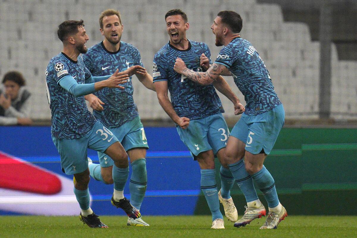 Tottenham's Clement Lenglet, second right, celebrates after scoring his side's first goal during the Champions League Group D soccer match between Marseille and Tottenham Hotspur at the Stade Velodrome in Marseille, France, Tuesday, Nov. 1, 2022. (AP Photo/Daniel Cole)