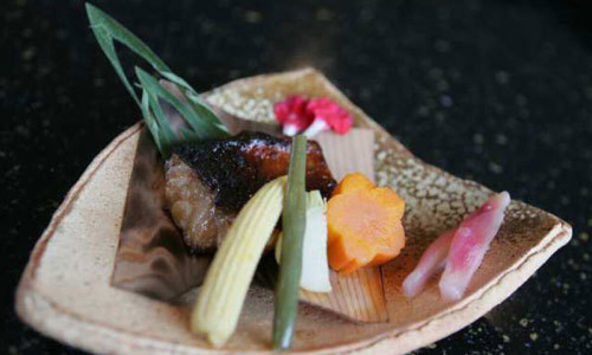 Part of the Omakase menu: Grilled rockfish "Kinki Wakasa Yaki" is presented at Kiwami in Studio City.