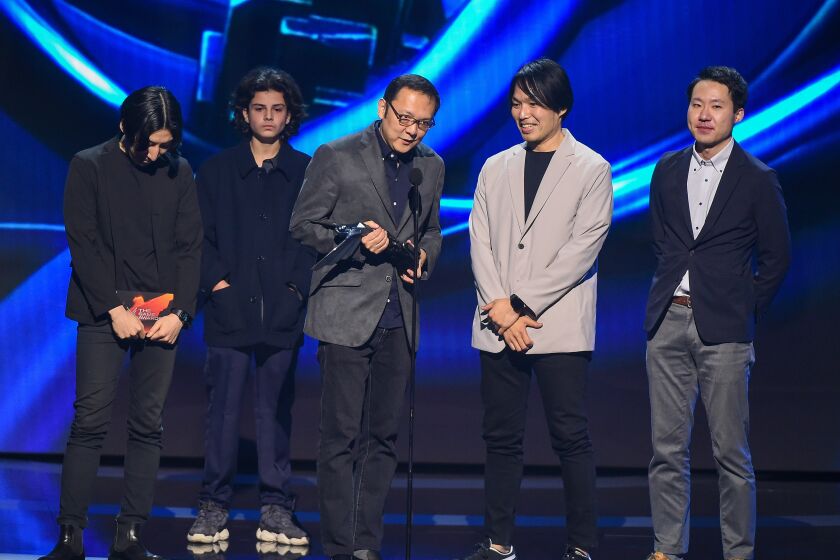 Hidetaka Miyazaki (C) and the team from Elden Ring, winner of "Game of the Year" onstage at The Game Awards 2022.