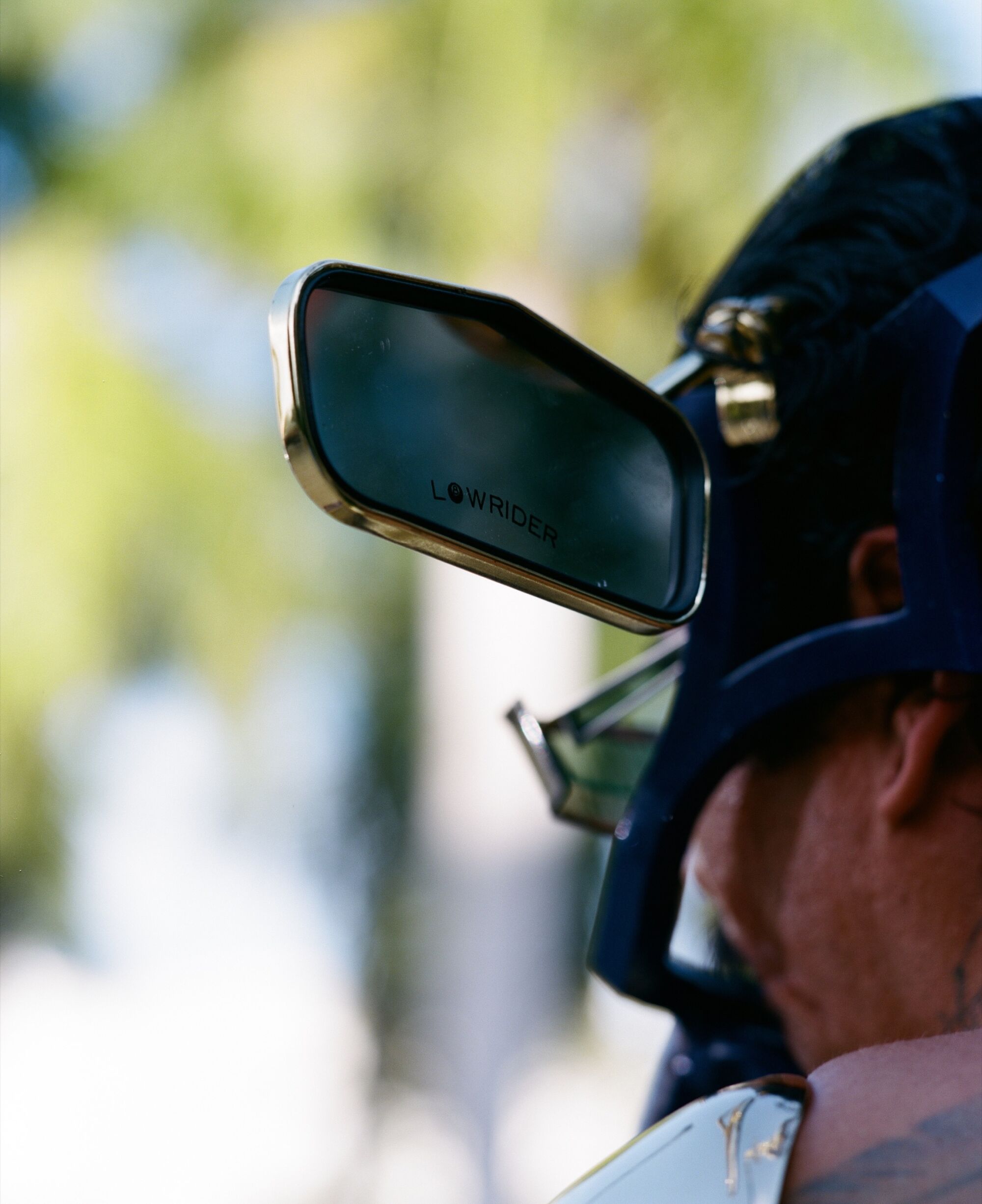 Photo of side mirrors fastened to rafa esparza's head.