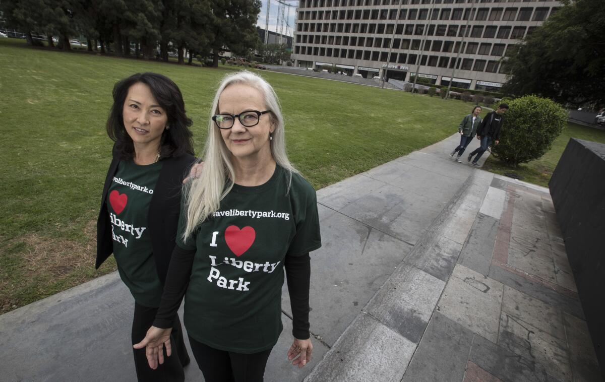 Annette Van Duren, right, and Anne Kim, left, are residents who spearheaded the campaign to save the rare green space in Koreatown. Their efforts raised the question — what does a private developer owe the community surrounding his property?