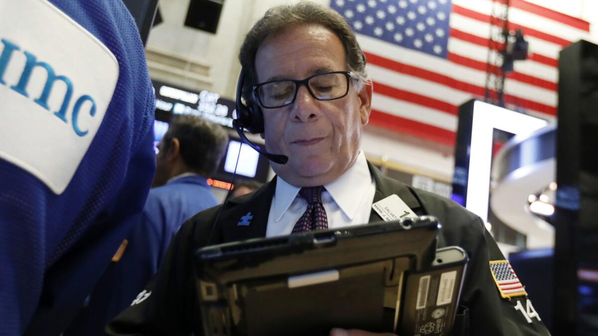 Trader Sal Suarino works on the floor of the New York Stock Exchange earlier this month.