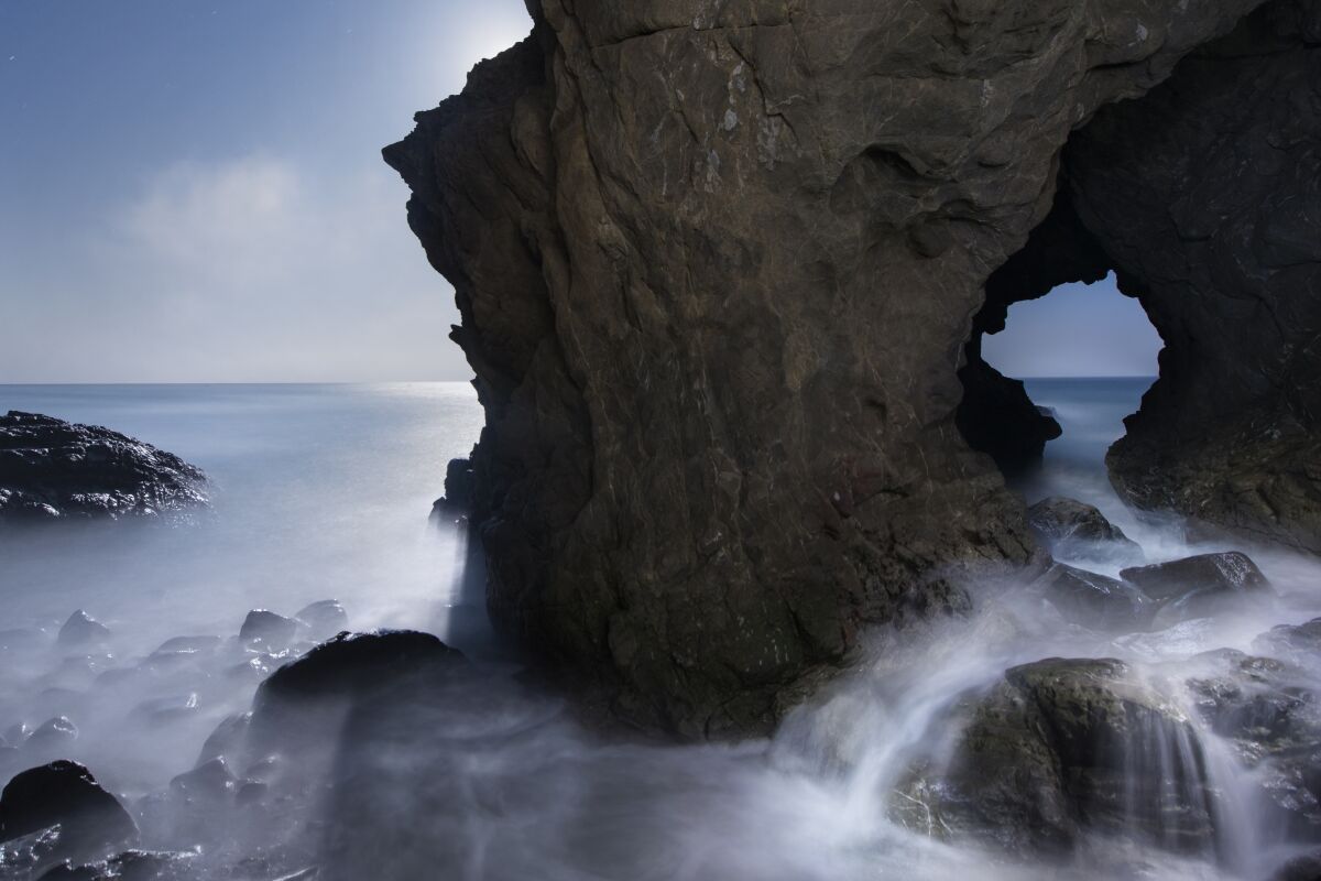 Mist flows out of a cave at Leo Carrillo State Park. 