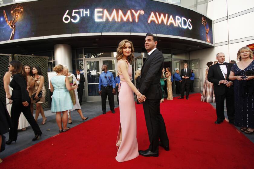 Rose Byrne and Bobby Cannavale walk the red carpet together at the 65th Primetime Emmy Awards on Sept. 22, 2013.