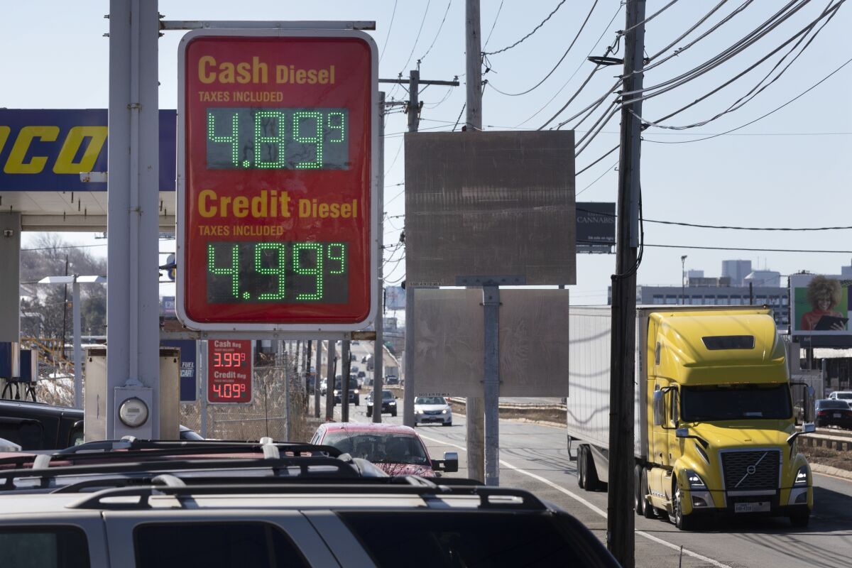 A sign at a gas station on Rte. 1A displays the price of diesel fuel, Friday, March 4, 2022, in Boston. (AP Photo/Michael Dwyer)