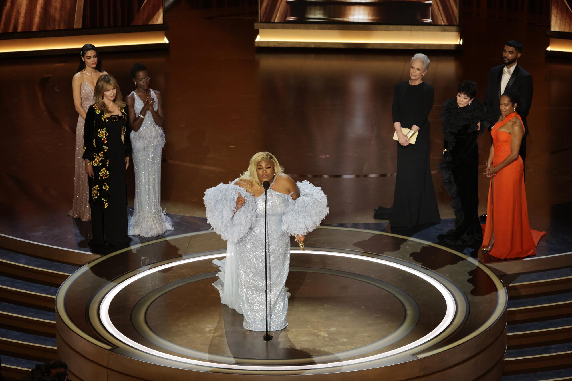 Da’Vine Joy Randolph in a silver dress onstage.