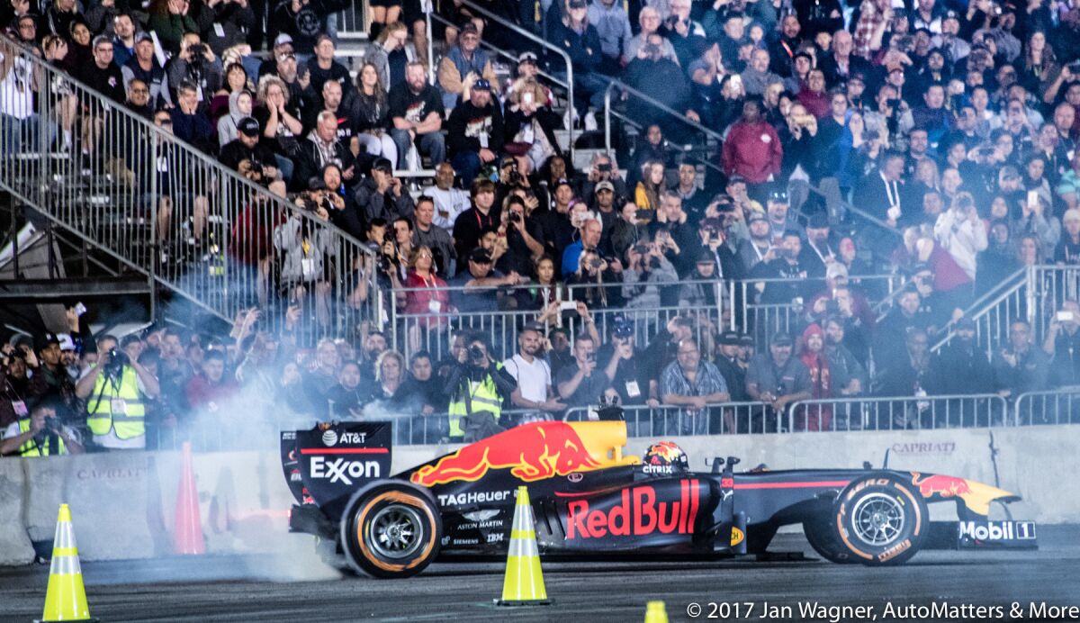 Max Verstappen drifting a Red Bull Formula One car at “SEMA Ignited”