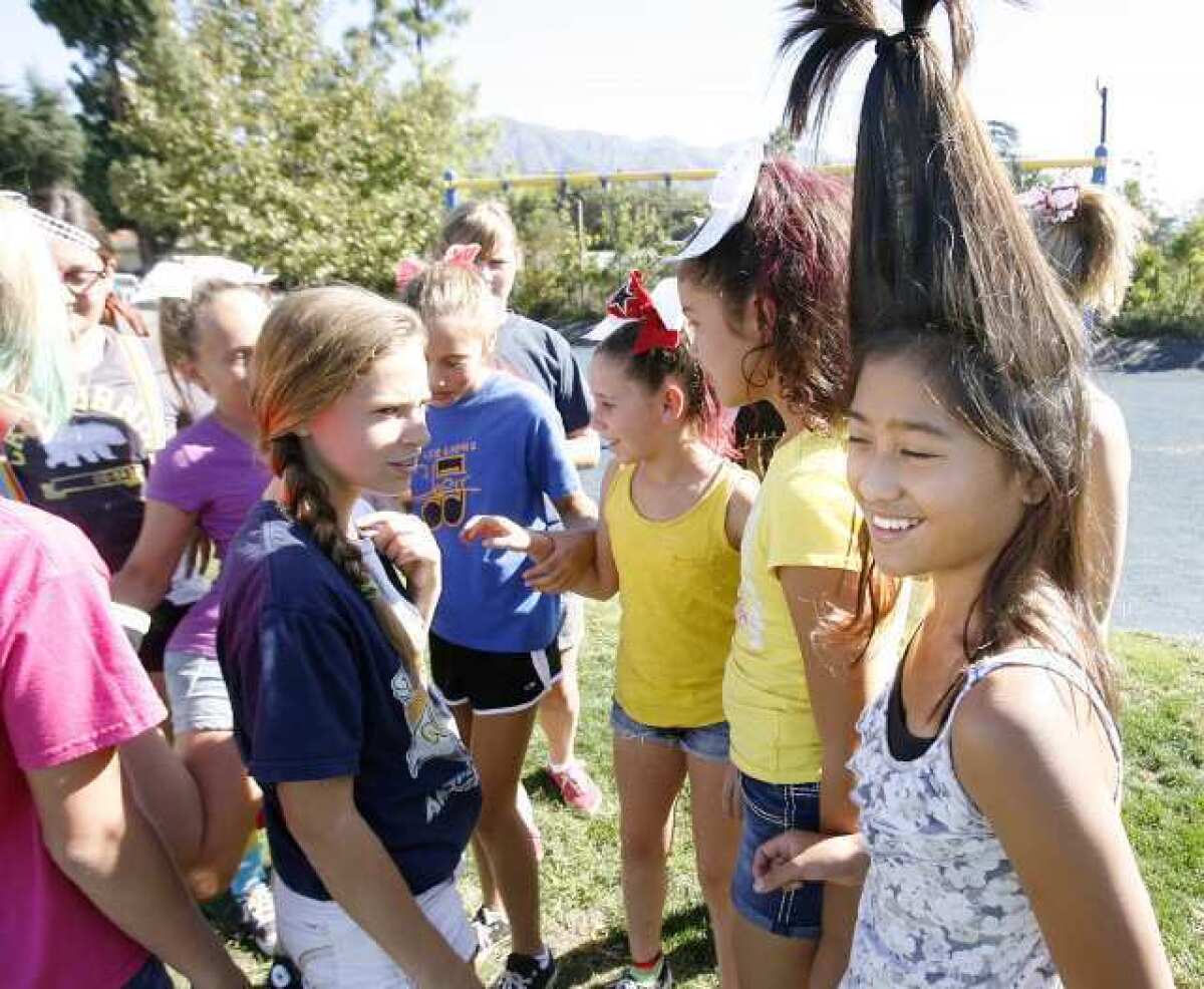 Keiko Segismundo, 11, put her hair up tall as she enjoys herself with her 6th grade friends during recess on wild hair day for Red Ribbon Week at La Canada Elementary School.