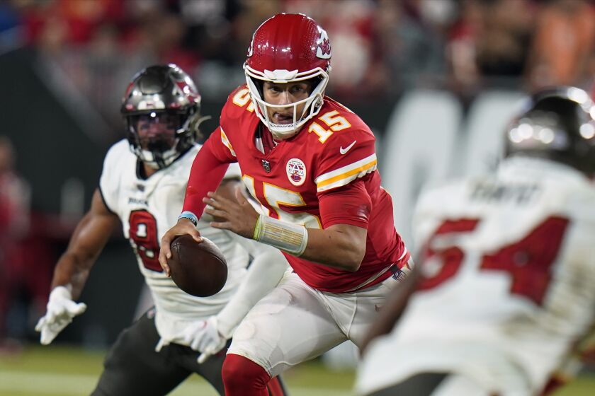 Kansas City Chiefs quarterback Patrick Mahomes (15) scrambles during the second half of an NFL football game against the Tampa Bay Buccaneers Sunday, Oct. 2, 2022, in Tampa, Fla. (AP Photo/Chris O'Meara)