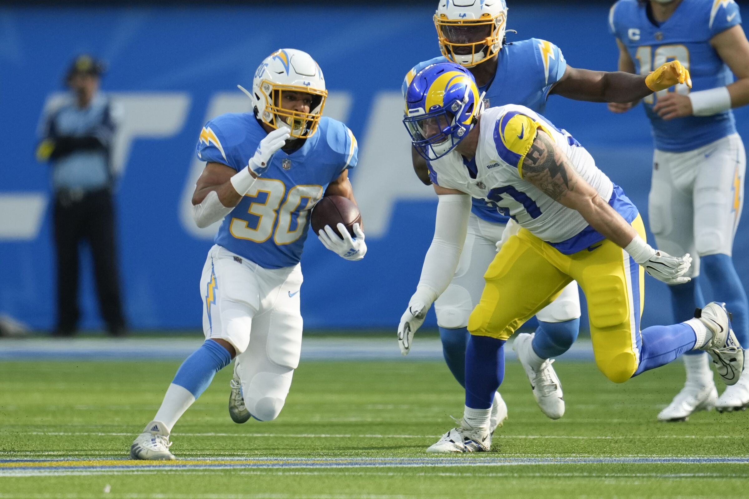 Chargers running back Austin Ekeler carries the ball Jan. 1, 2023, against the Rams.