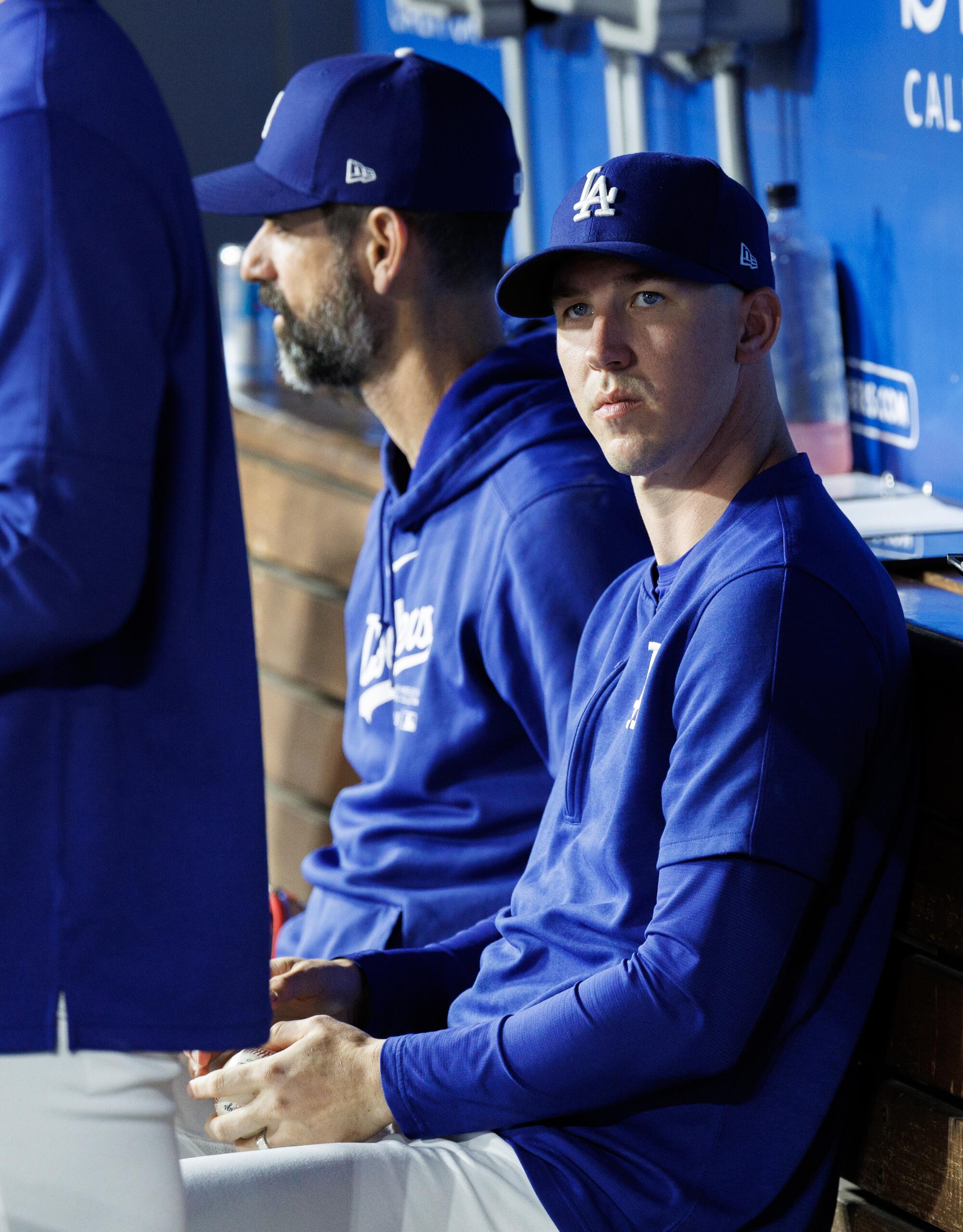 Dodgers pitcher Walker Buehler, sits in the dugout during a game against the Giants at Dodger Stadium on July 24.