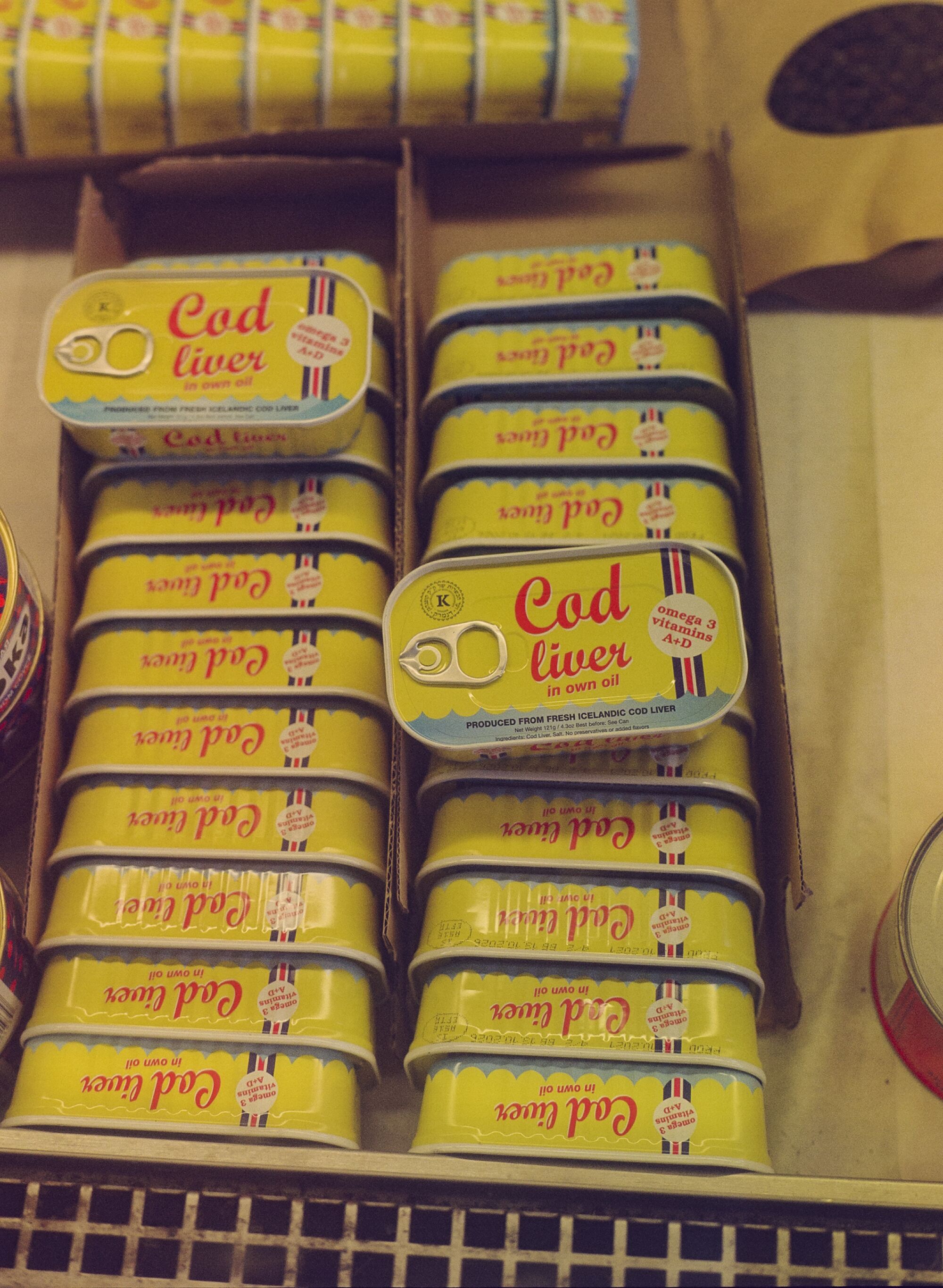 Yellow cod liver tins at Cherry Garden