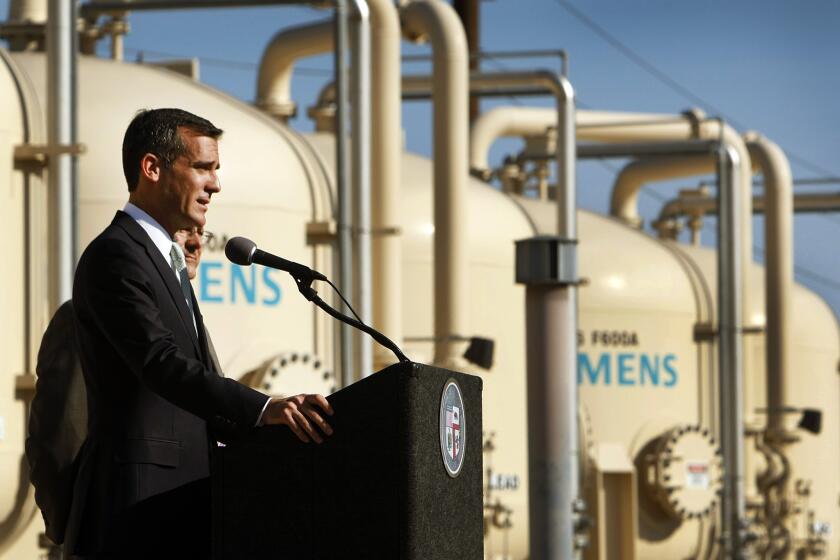 Mayor Eric Garcetti tours the Tujunga Spreading Grounds, a stormwater capture and groundwater replenishment project in Arleta, in 2014.