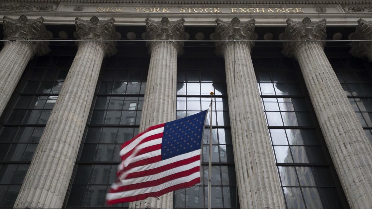 An American flag flies outside the New York Stock Exchange.