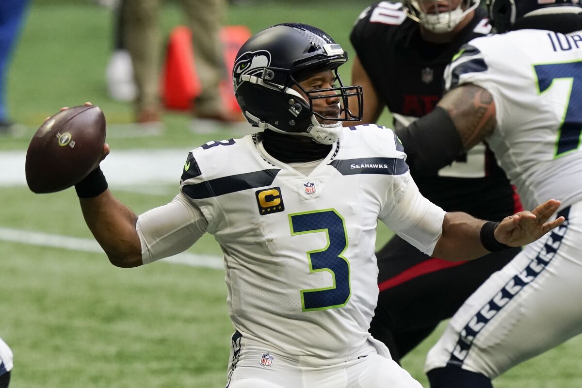 Seattle Seahawks quarterback Russell Wilson (3) works in the p[ocket against the Atlanta Falcons during the first half of an NFL football game, Sunday, Sept. 13, 2020, in Atlanta. (AP Photo/Brynn Anderson)