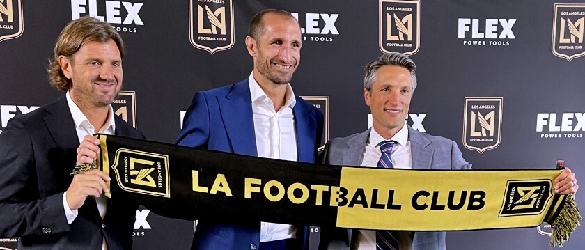 Agent Davide Lippi, left; Giorgio Chiellini, center; a
