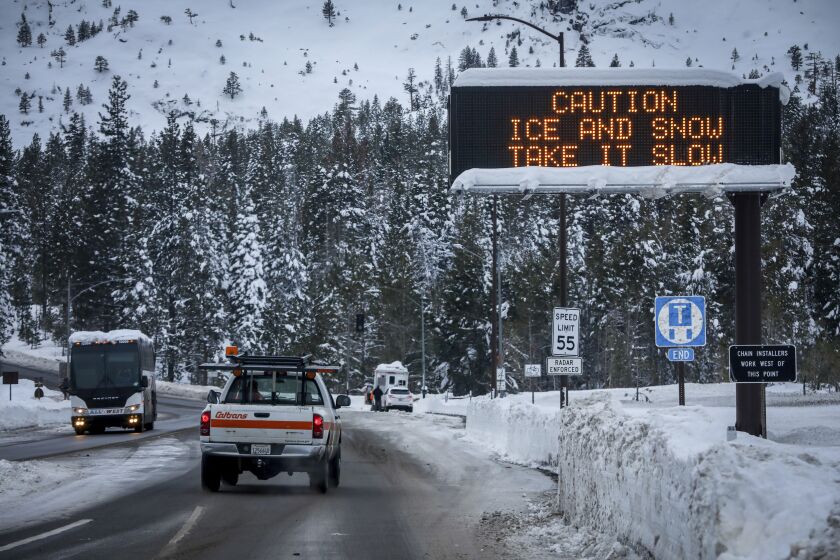 FILE - Huge amounts of snow are seen after a series of storms blasted communities surrounding South Lake Tahoe, Calif. on Jan. 4, 2023. California Gov. Gavin Newsom announced, Friday, March 24, 2023, an end to some drought restrictions and calls for water conservation, following a series of winter storms have dramatically improved the state's water supply outlook. (Brontë Wittpenn/San Francisco Chronicle via AP, File)