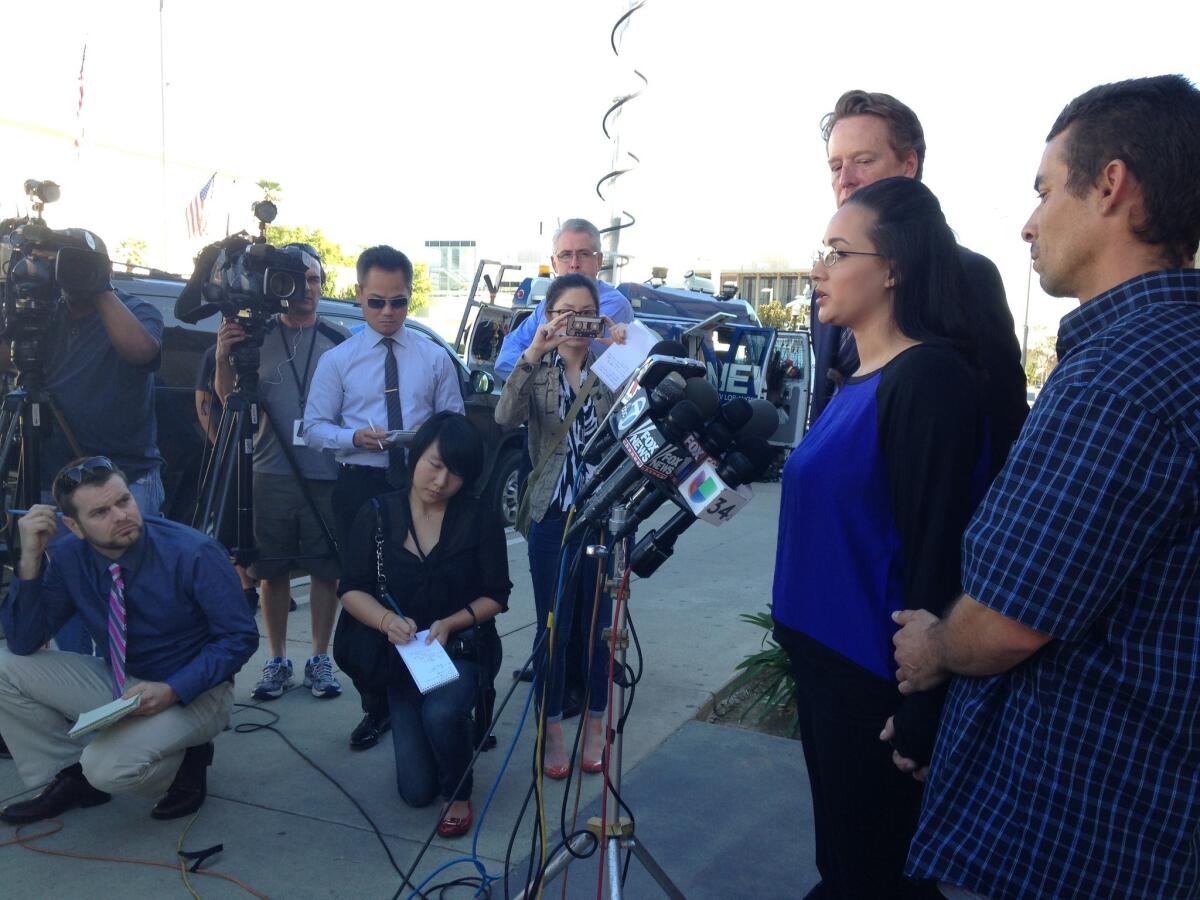 Jamie, her fiance, right; and her attorney address the media in front of Alhambra High School on Tuesday afternoon.