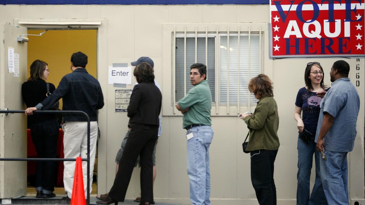 Voters wait outside a polling place held in a trailer at a grocery store parking lot on February 19, 2008 in Austin, Texas.