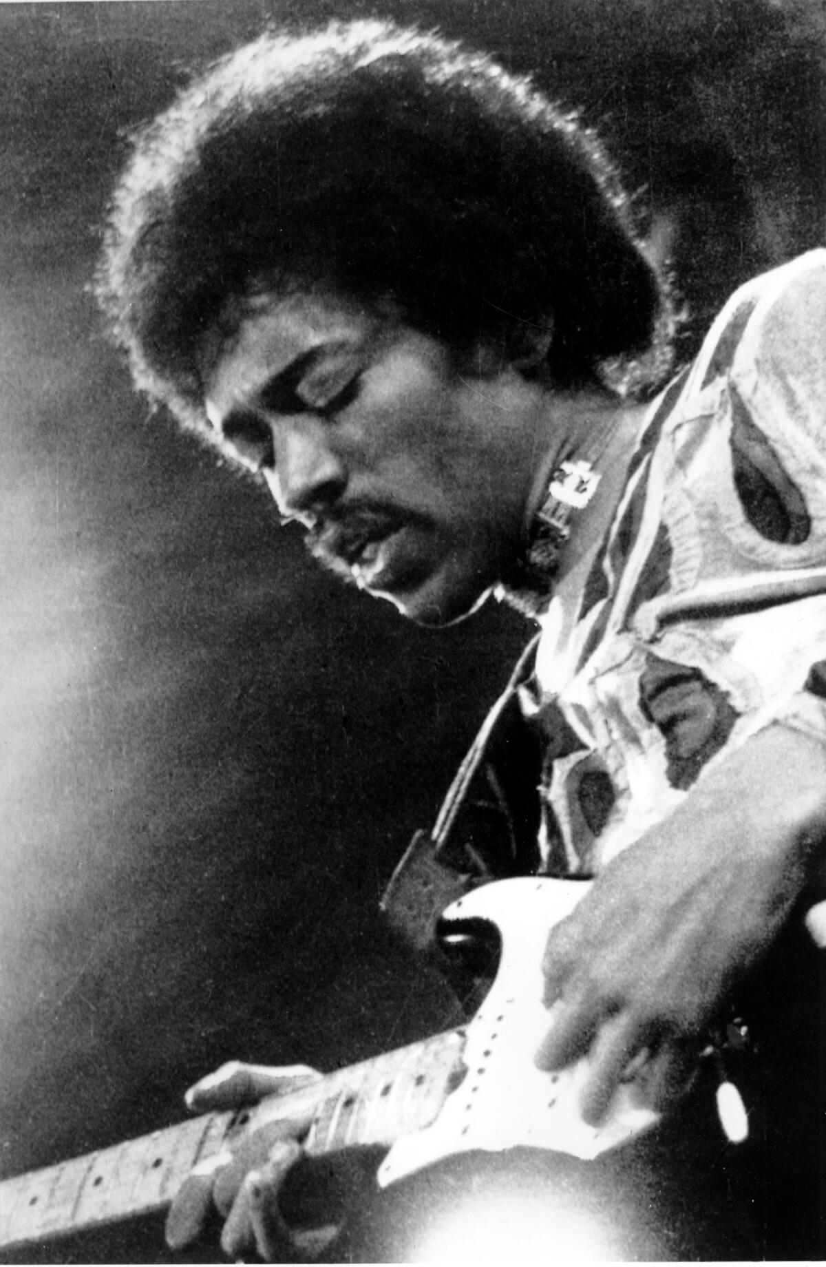 In this 1970 file photo, rock star Jimi Hendrix is shown performing on the Isle of Wight in England.