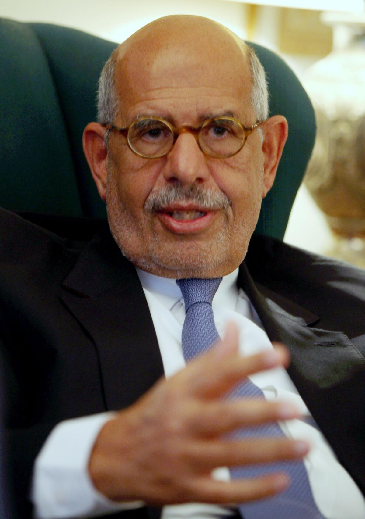 Mohamed ElBaradei speaks to a small group of journalists on April 30 at his house on the outskirts of Cairo. His office says the pro-reform leader has been named interim prime minister of Egypt.