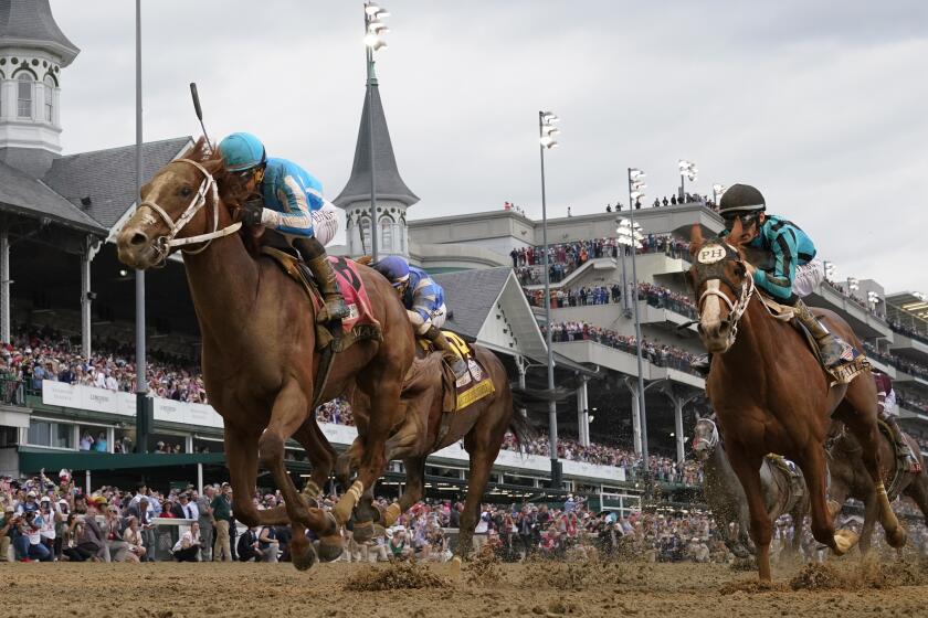 FILE - Mage (8), with Javier Castellano aboard, wins the 149th running of the Kentucky Derby horse.