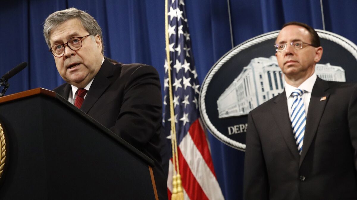 Atty. Gen William Barr speaks alongside then-Deputy Atty. Gen. Rod Rosenstein at the April news conference in which Barr concluded that Robert S. Mueller's Russia investigation found no wrongdoing on the part of President Trump.