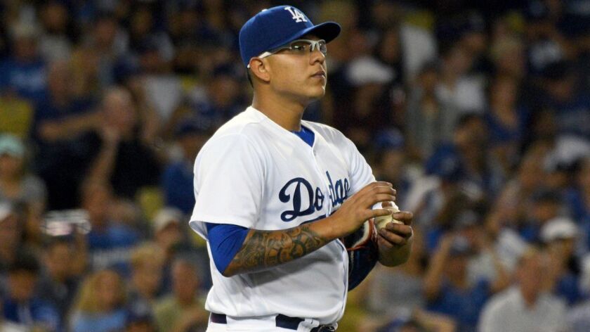 Dodgers' pitcher Julio Urias gathers himself after giving up a two-run double against the Miami Marlins on Saturday.