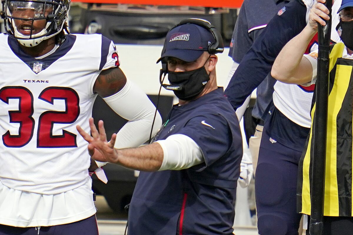 Houston Texans head coach Bill O'Brien, center, gives signals from the sideline during the second half of an NFL football game against the Pittsburgh Steelers in Pittsburgh, Sunday, Sept. 27, 2020. (AP Photo/Gene J. Puskar)
