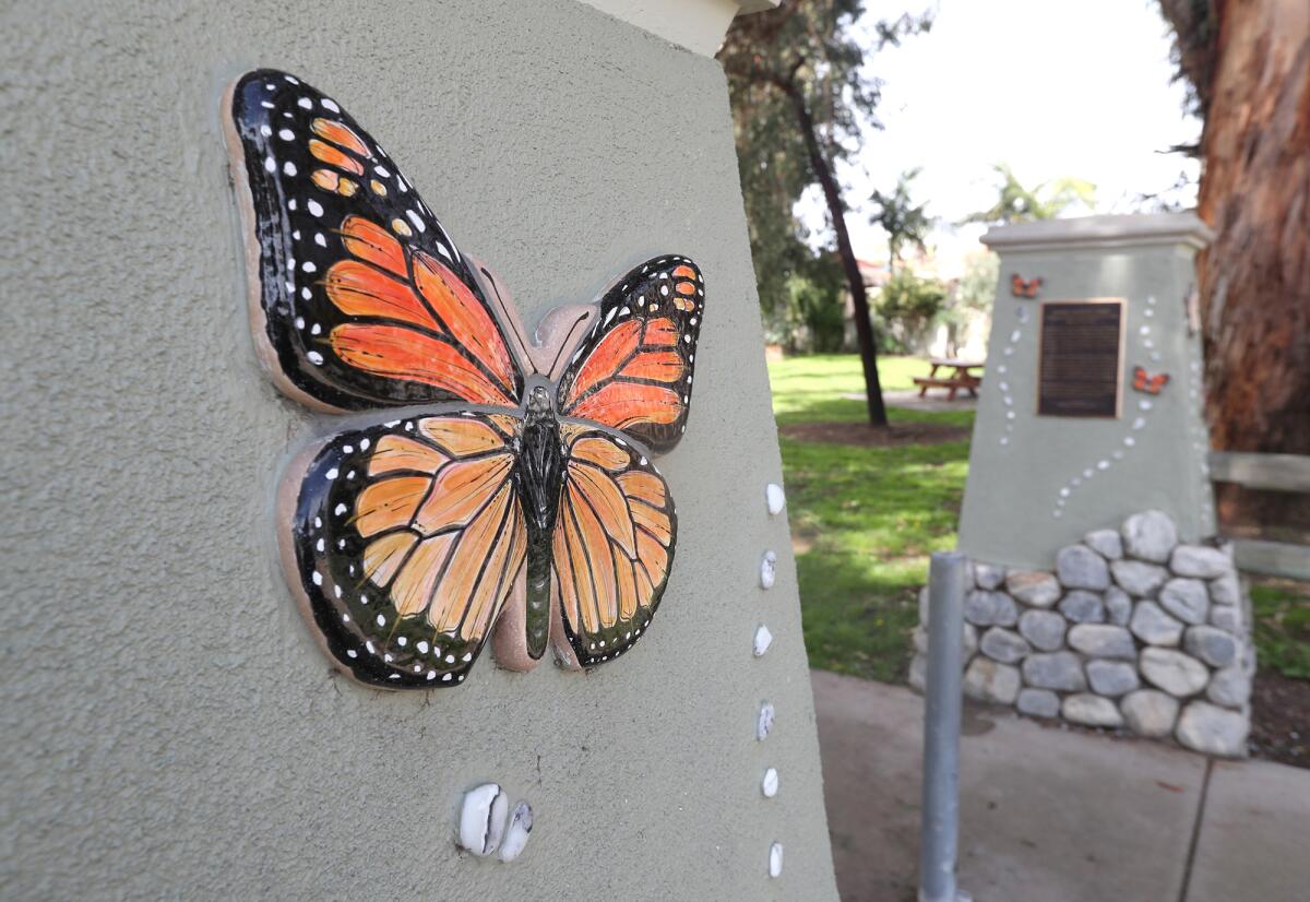 Artwork featuring monarch butterflies greets visitors to Norma Gibbs Butterfly Park in Huntington Beach.